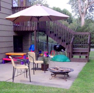 Patio umbrella cement slab deck fire pit