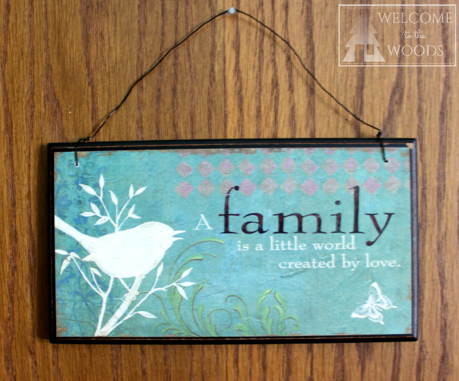 Wall hanging for the nursery with cute quote, "A Family is a little world created by love."