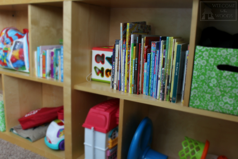 Tons of storage for books on IKEA bookshelves, all easily accessible to little kids!