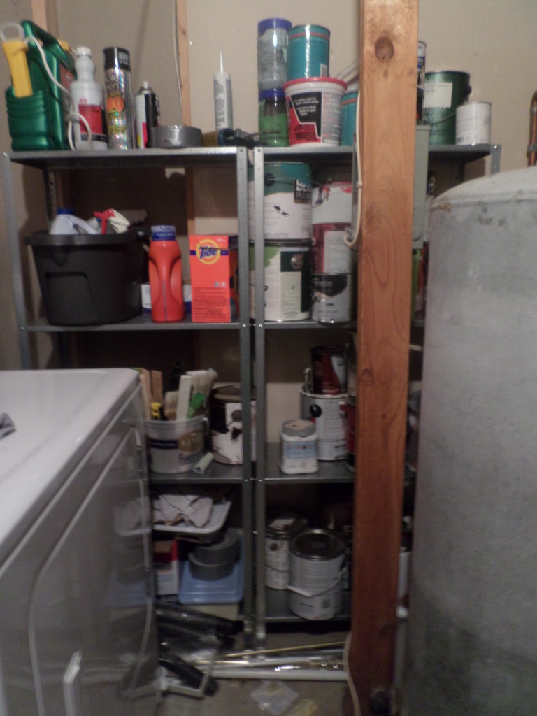 Shelving store paint and supplies in utility laundry room