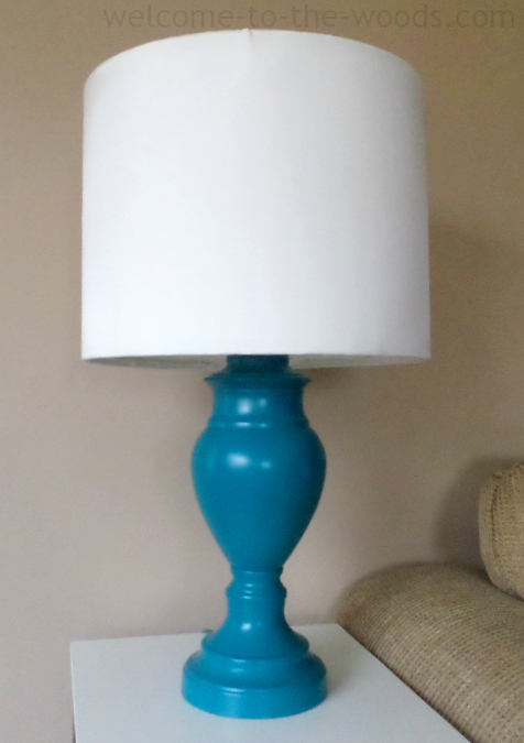 Would you believe this used to be an outdate brass lamp? Give your light fixture a makeover with a DIY lamp shade and spray painting the base a fun teal color!