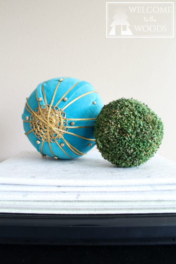 Spring home decor accessories moss ball and teal gold pin cushion.