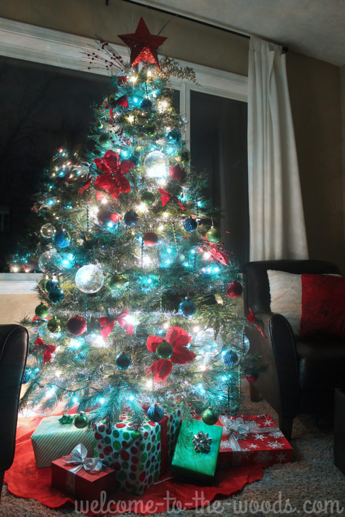 There's nothing more magical that a Christmas Tree lit up at night! These blue and white lights sparkle amidst red, green, silver, and blue ornaments on this beautiful tree!