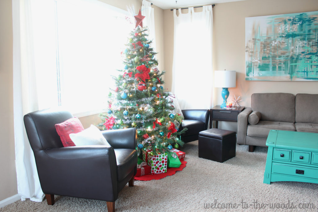 Christmas tree placement in the living room, in front of large window and between two sitting chairs. I love that it is the focal point and you can see it lit up from outside at night!