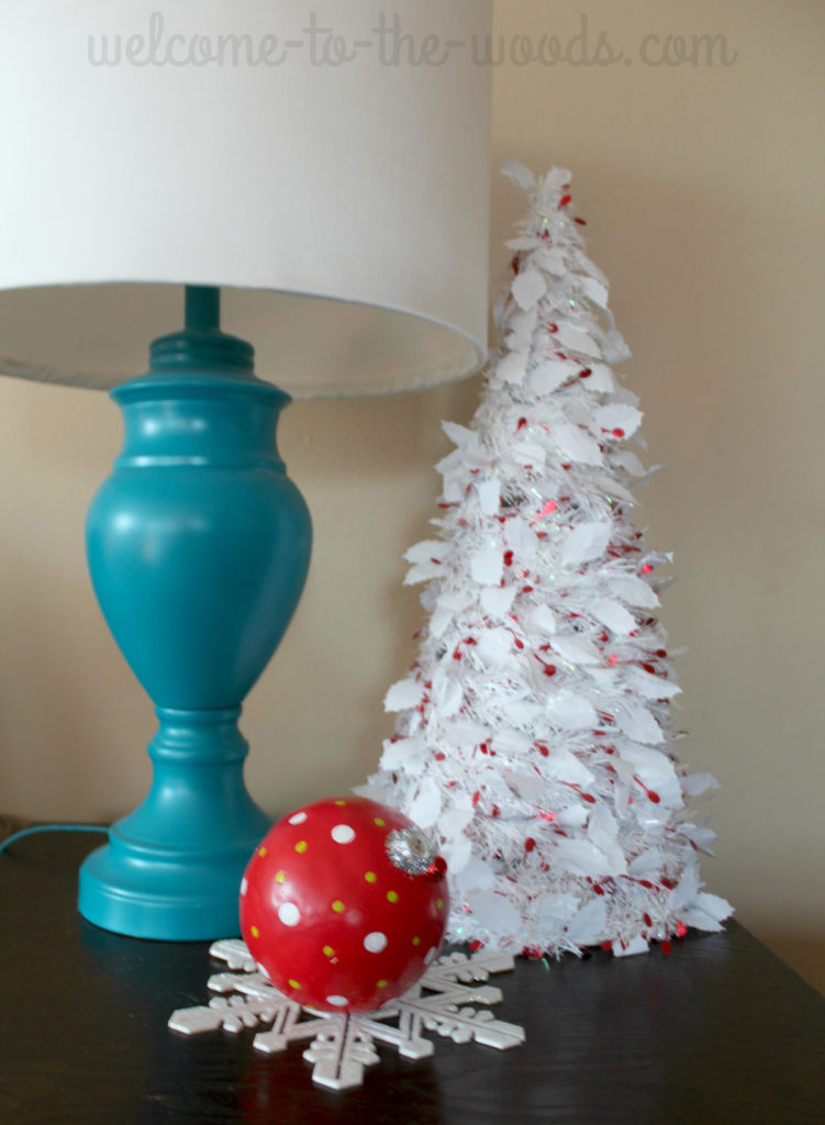 Love this white mini tree for the end table decor, the giant ornament and glitter snowflake are nice touches, too.