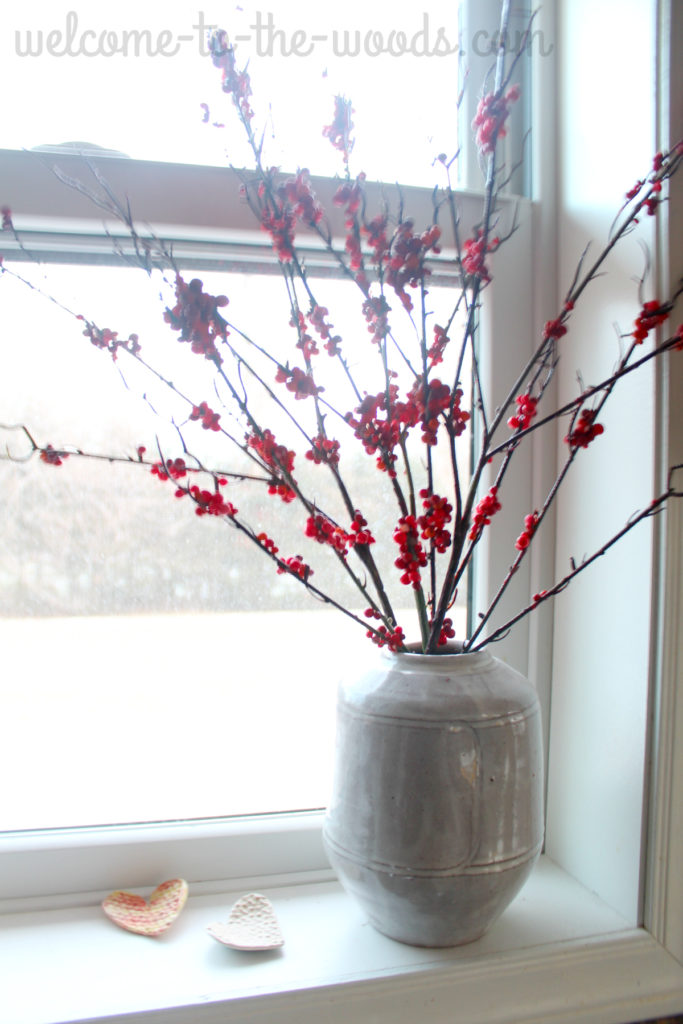 Christmas window sill decor, handmade pottery vase and red winter berry branches. Absolutely beautiful!