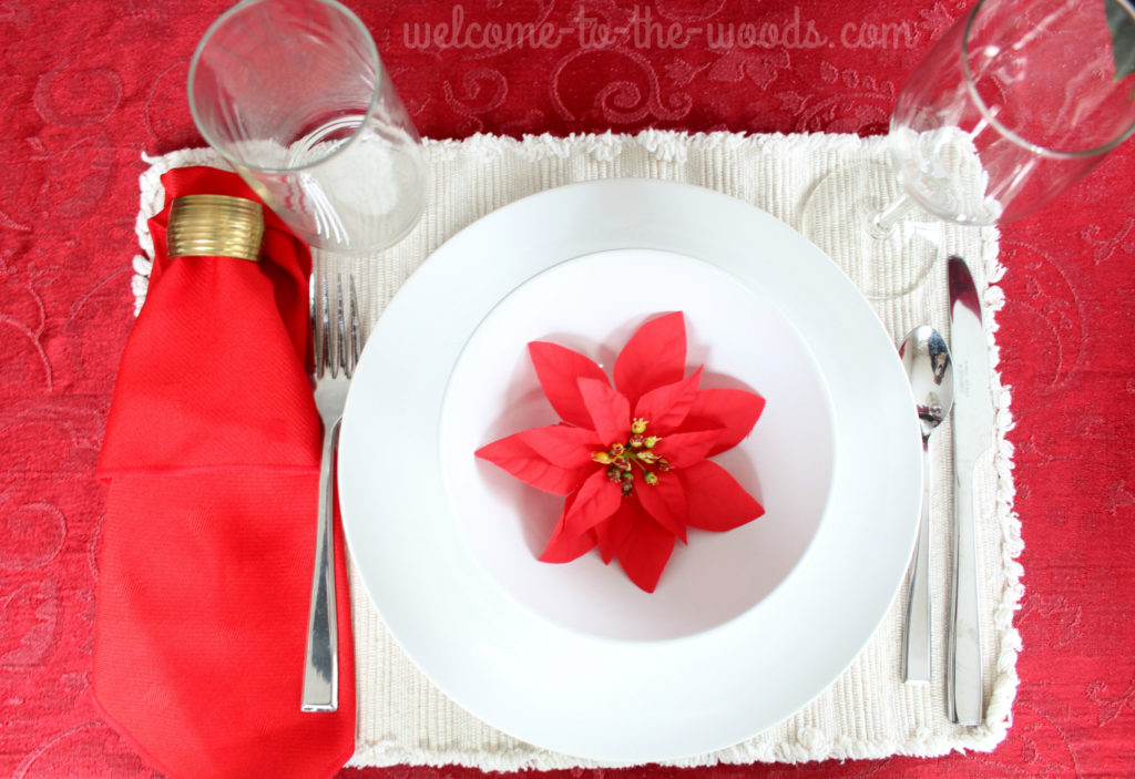 Christmas holiday tablescape in red with poinsettias.