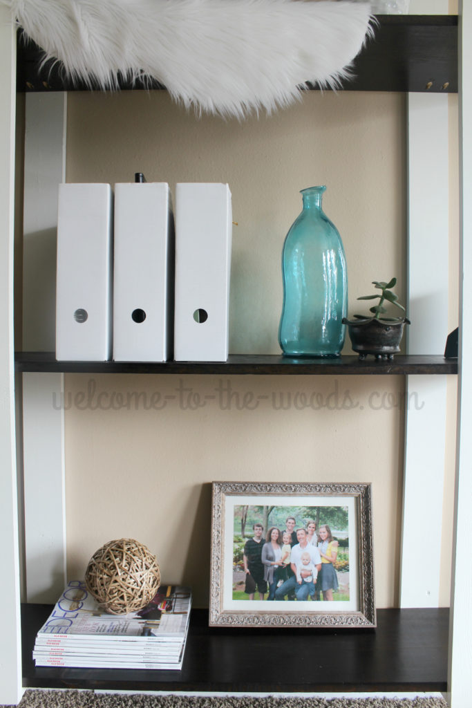 Modern diy shelves with white planks contrasting espresso stained shelves.