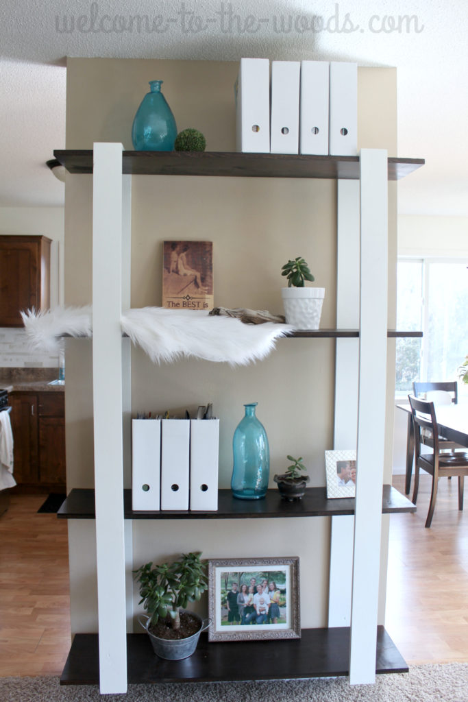 Custom built wood shelves for only $25 in lumber! Amazing modern design. I love it!