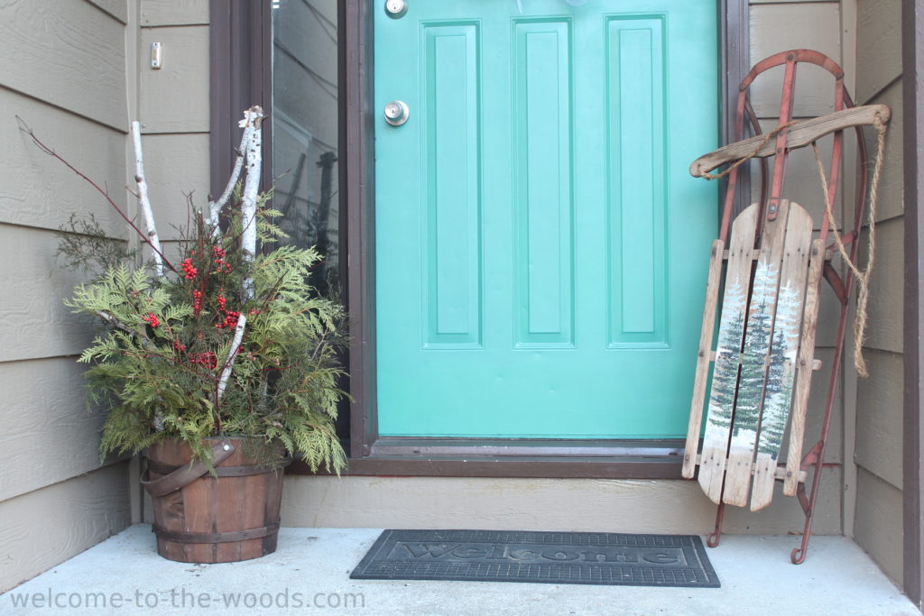 This painted vintage sled with pine tree forest scene is so adorable! 