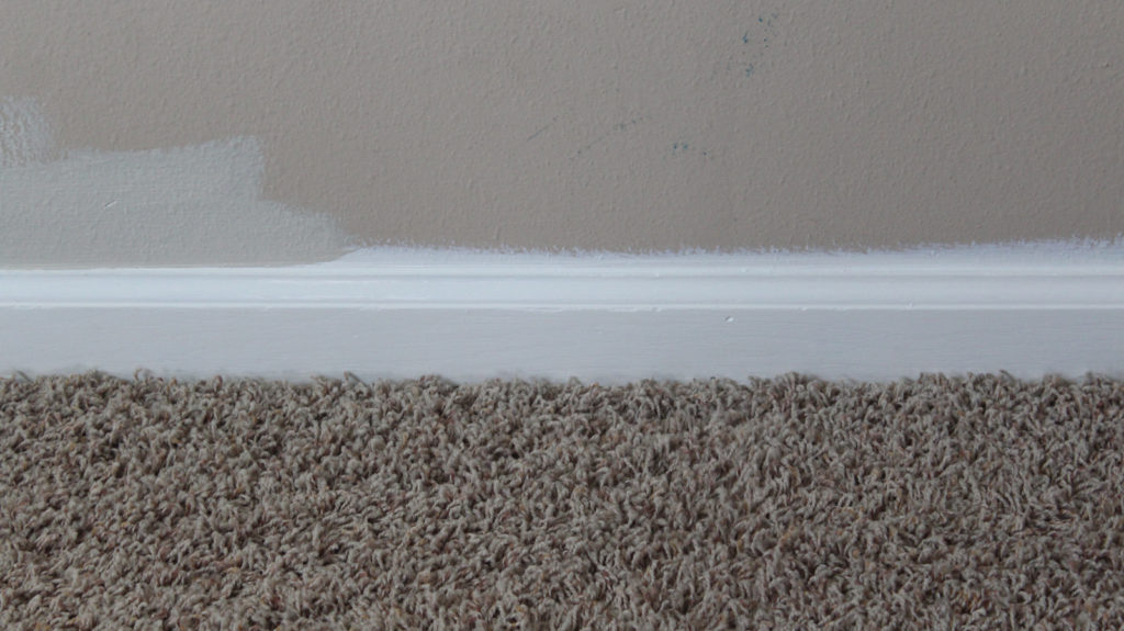 The proper way to paint a wall, including in what order you should caulk, paint trim, edge, and paint with a roller.